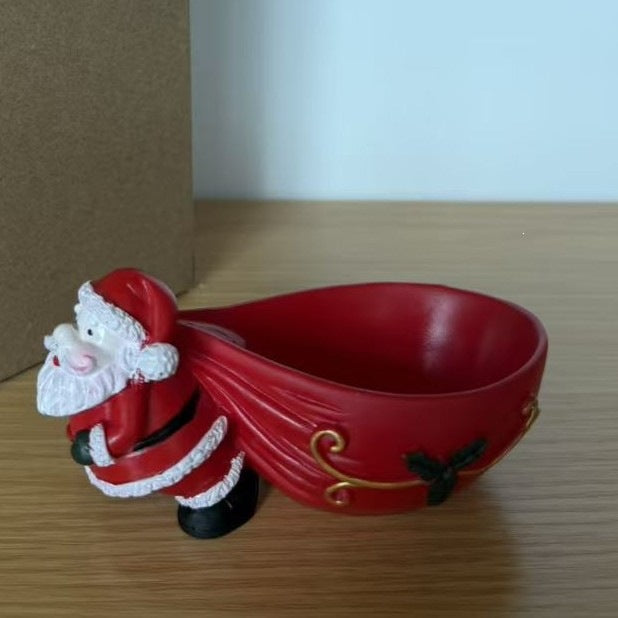 Weihnachtliche Schlittenfigur mit Weihnachtsmann zur festlichen Dekoration im Zuhause